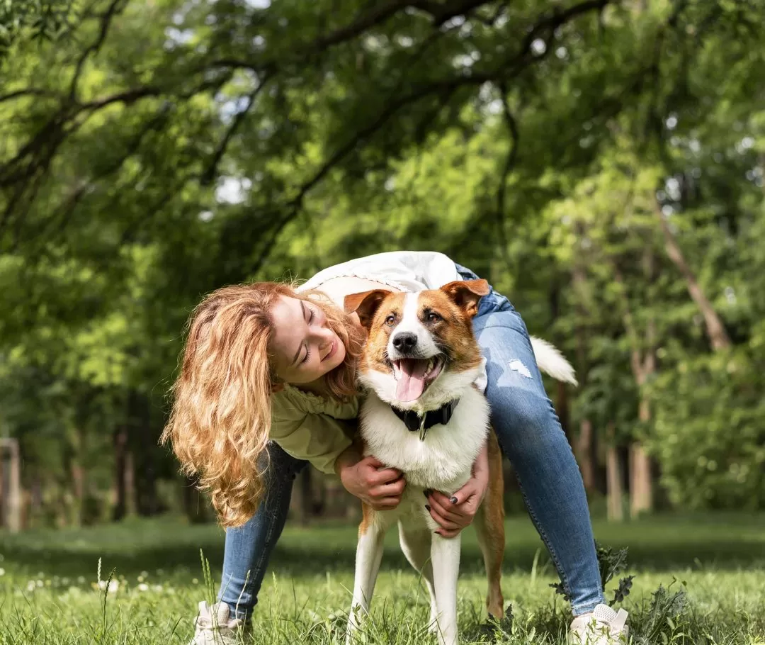 woman-playing-with-her-dog-park